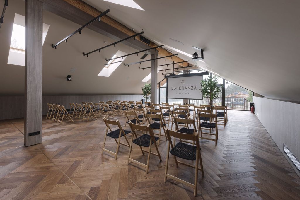 Modern conference room with panoramic windows, ideal for meetings and corporate events.