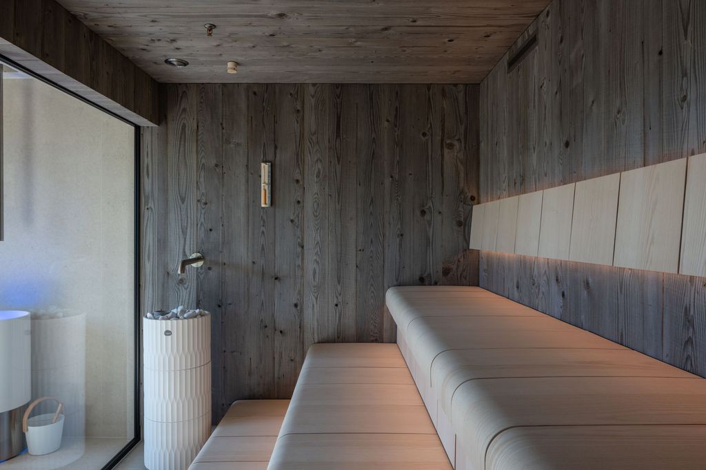 Inviting spa sauna with natural wood interior for a soothing thermal experience.
