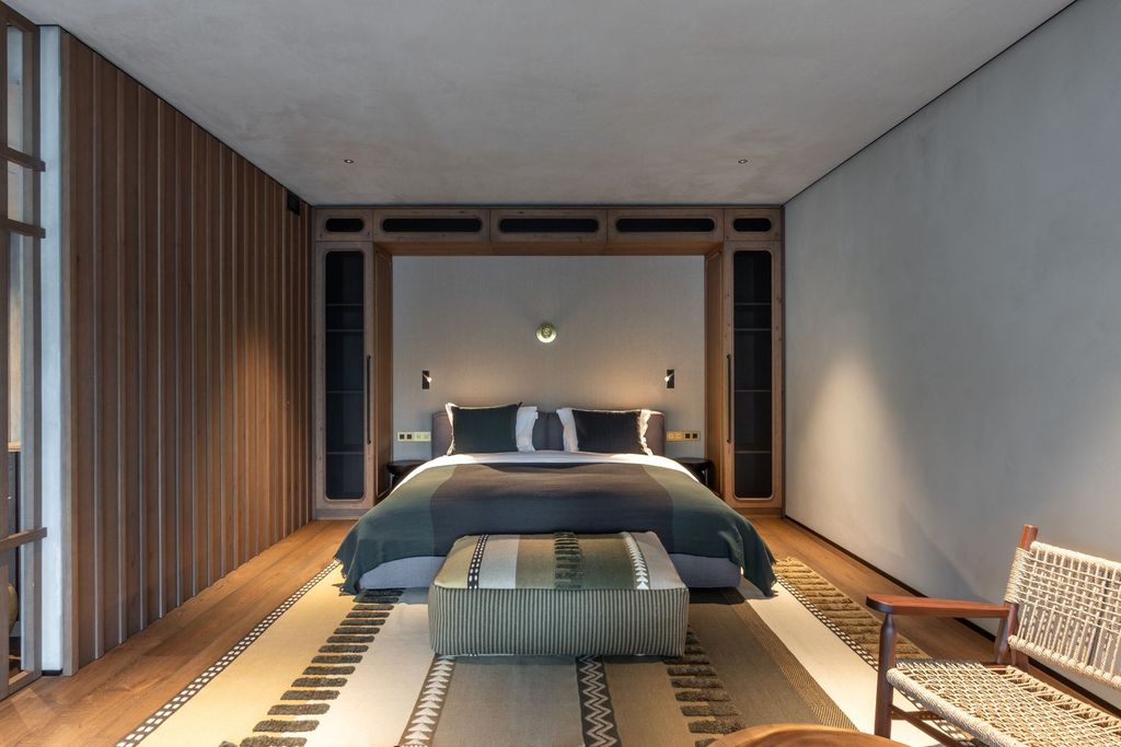 Elegant lakeview suite offering calming design, natural tones, and terrace views.