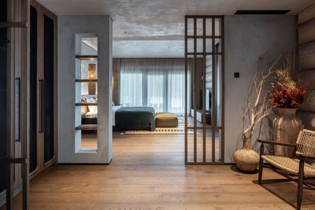 Elegant lakefront suite interior offering serene design and panoramic outlook.