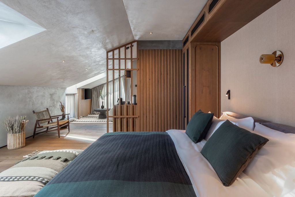 Loft Suite with private terrace and forest views, furnished for a serene retreat.