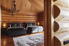 Large and elegant bedroom with two beds and calm tones for peaceful stays